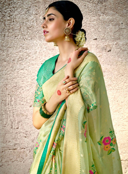 Pastel Green Kora Banarasi Saree With Delicate Floral Patterns